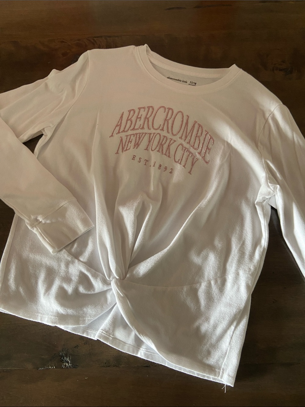 Abercrombie & Fitch White Long-Sleeve Twist Front Logo Top with Pink Embroidery